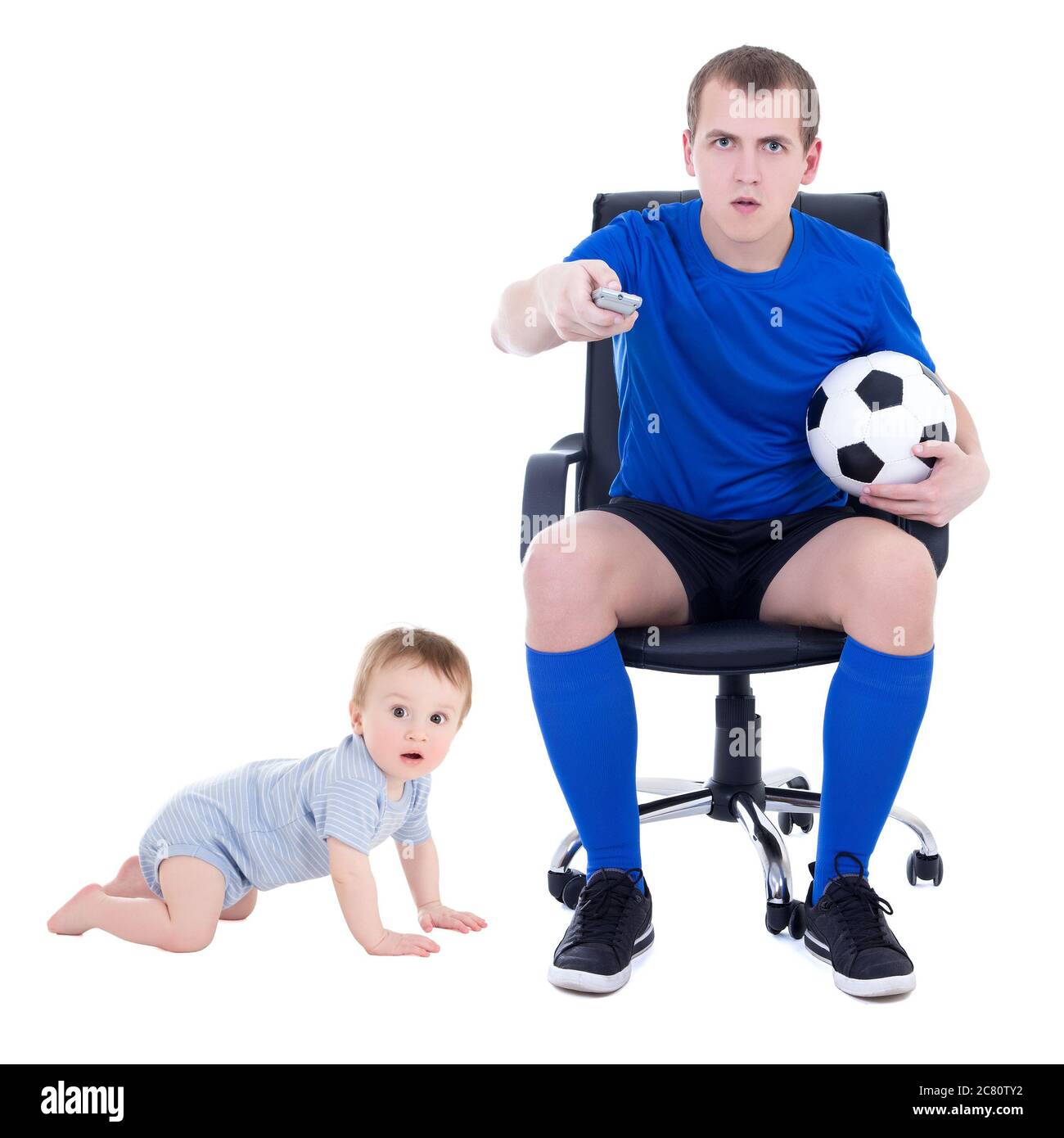 funny young man watching soccer game with little son isolated on white background Stock Photo