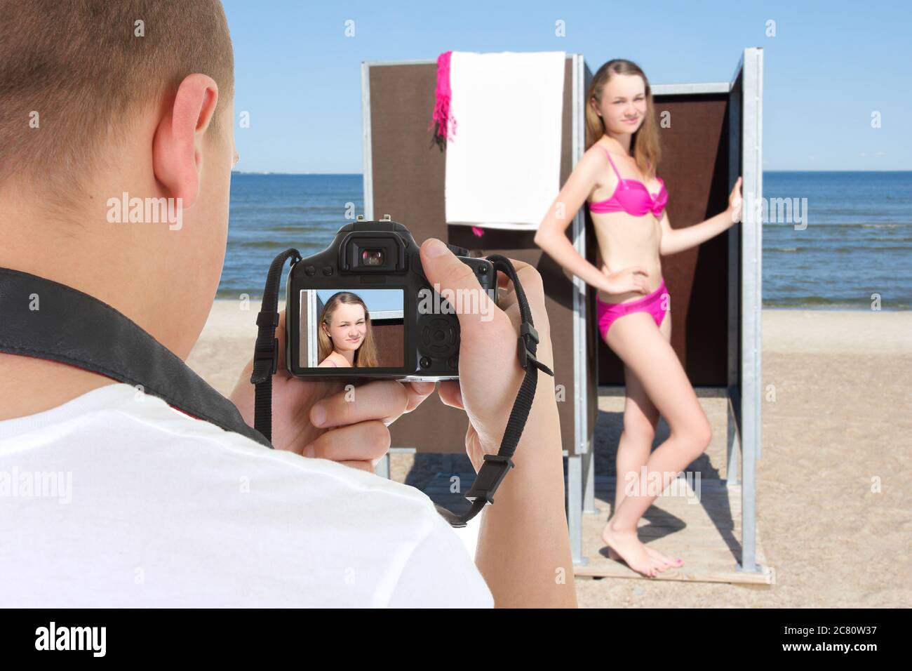 slim beautiful woman in changing cabin and photographer on the beach Stock  Photo - Alamy