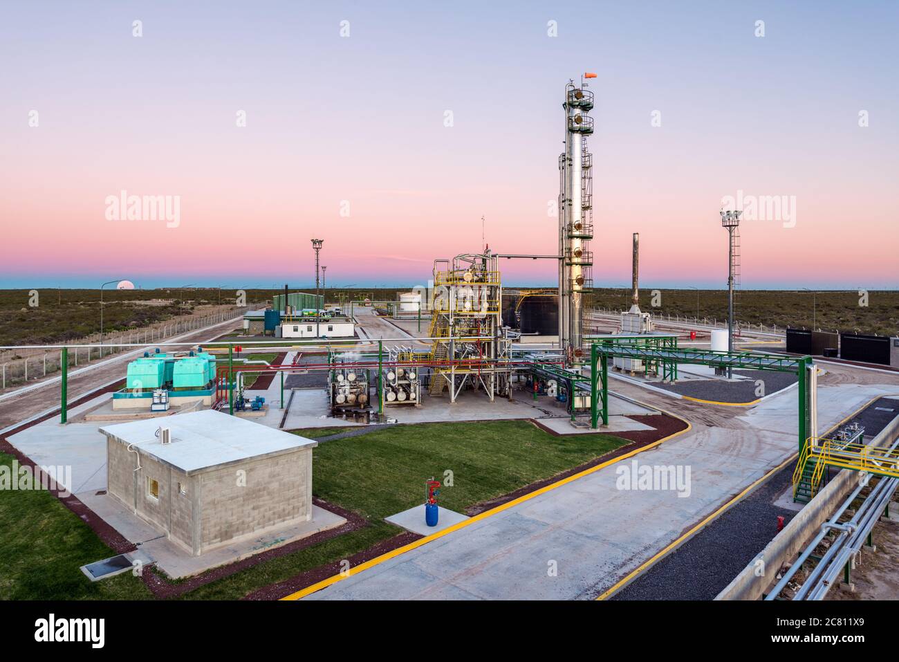 Elevated view at oil refinery plant from inside the facilities at dawn. Argentina. Stock Photo