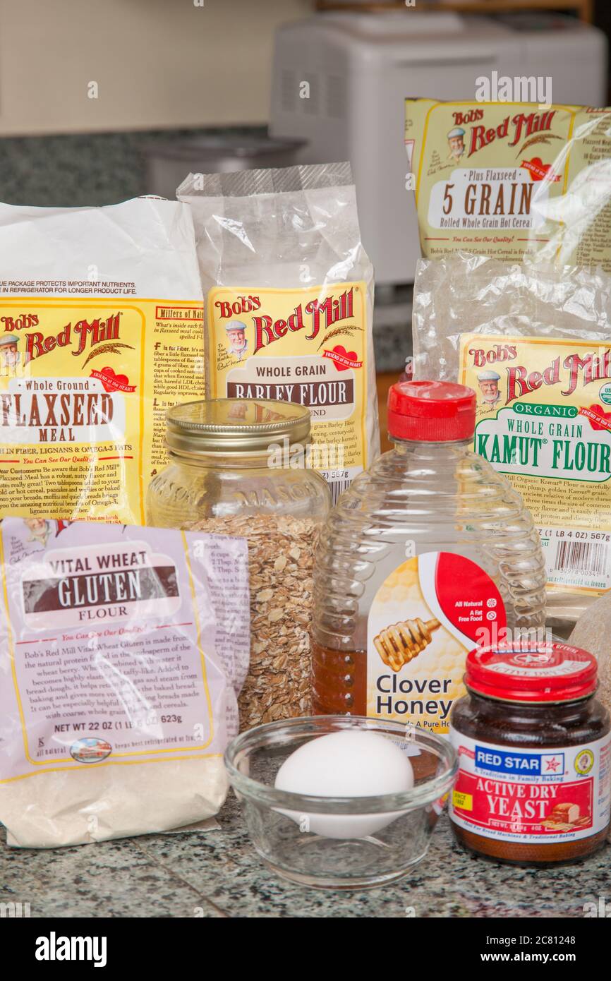 Breadmaking ingredients (various flours, honey, oats, yeast, egg ...