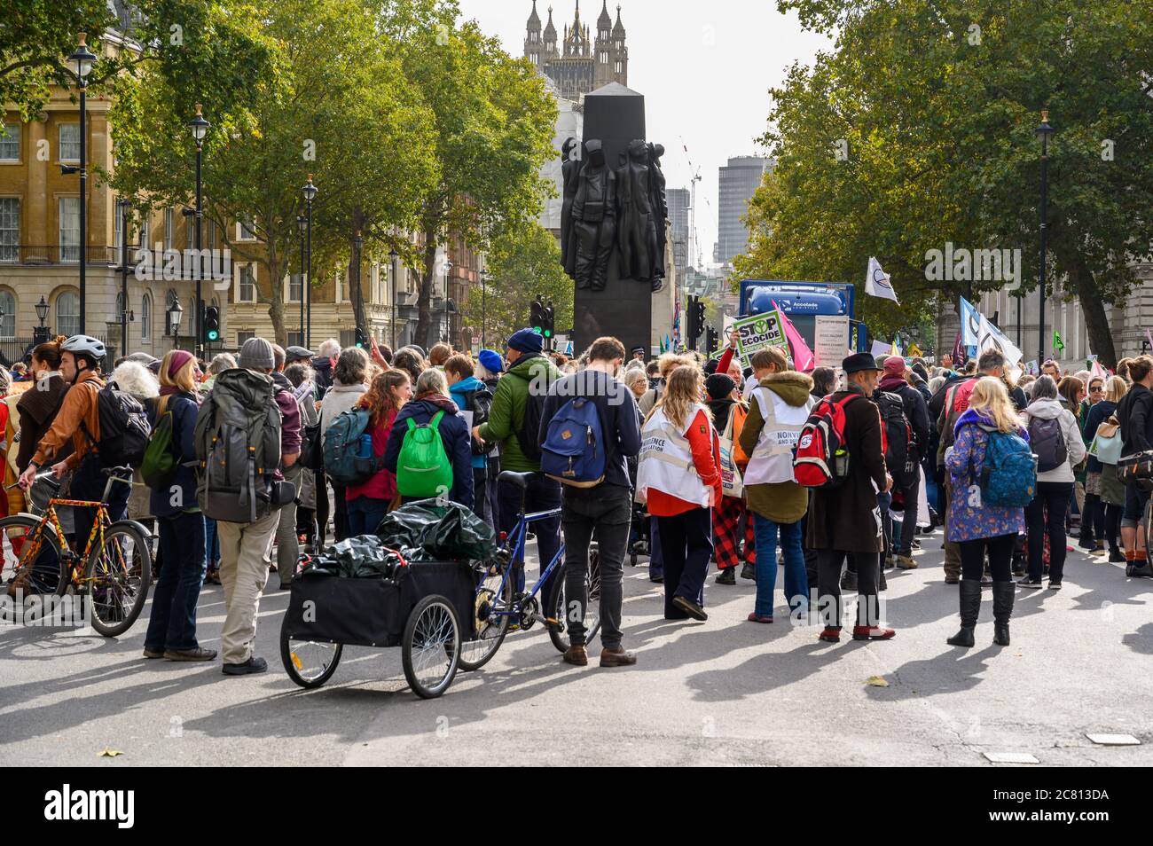 LONDON - OCTOBER 18, 2019: Extinction Rebellion Protesters surround The Women of World War II monument on Whitehall Stock Photo