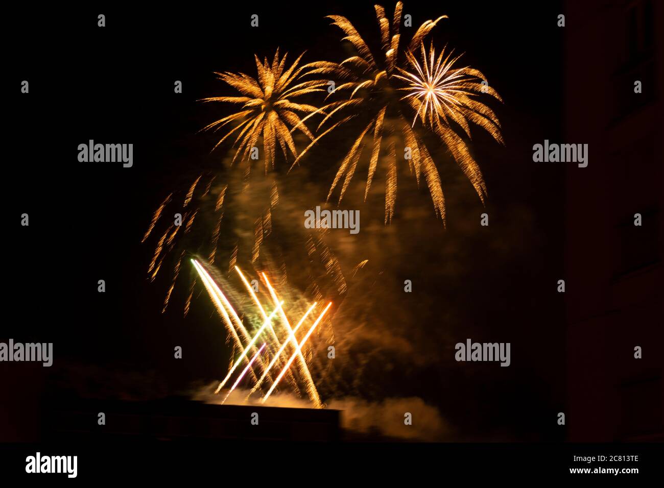 Colorful fireworks burst across the night sky in France, marking the celebration of Bastille Day on July 14th. Stock Photo