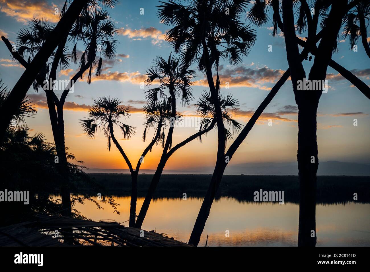 Sunset over the natural hot spring oasis at Doho Safari Lodge in the ...