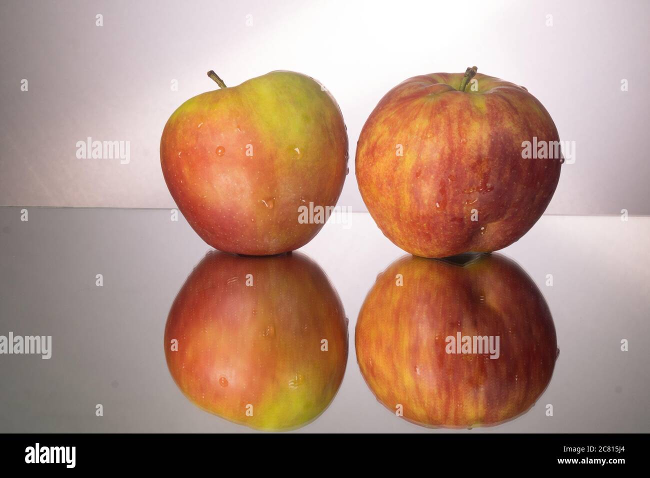 red apple on mirroring table. Gorizontal image with copy space. Stock Photo