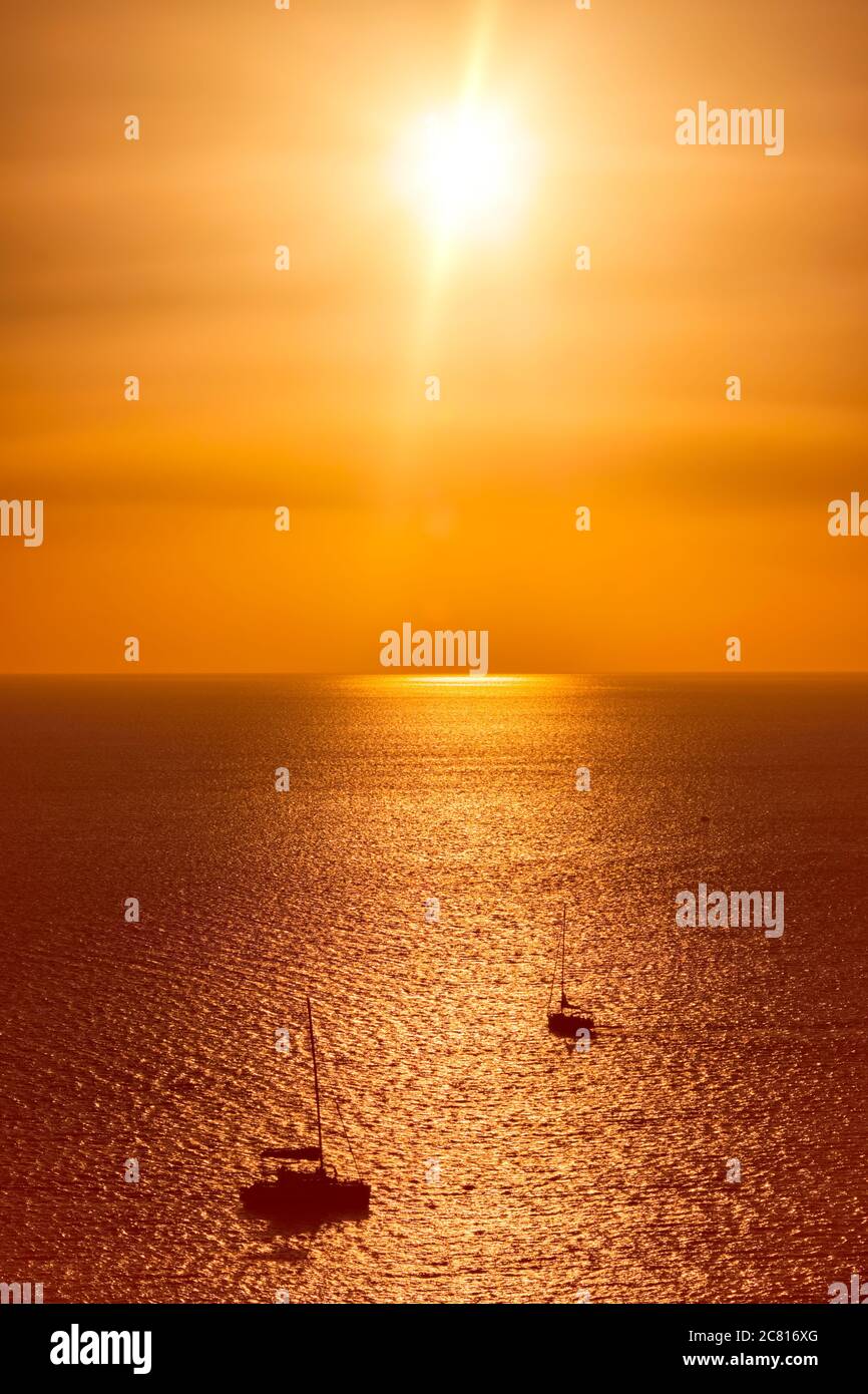 Yacht silhouettes in Aegean sea on sunset Stock Photo - Alamy