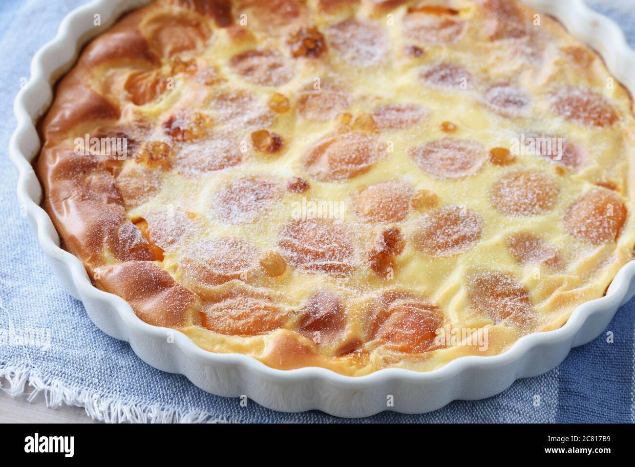 Just baked apricot clafoutis, the traditional French dessert, in a