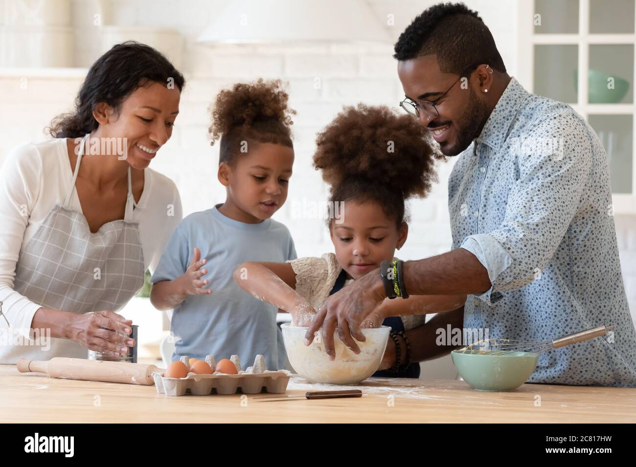 black-family-baking-cookies-together-hi-res-stock-photography-and