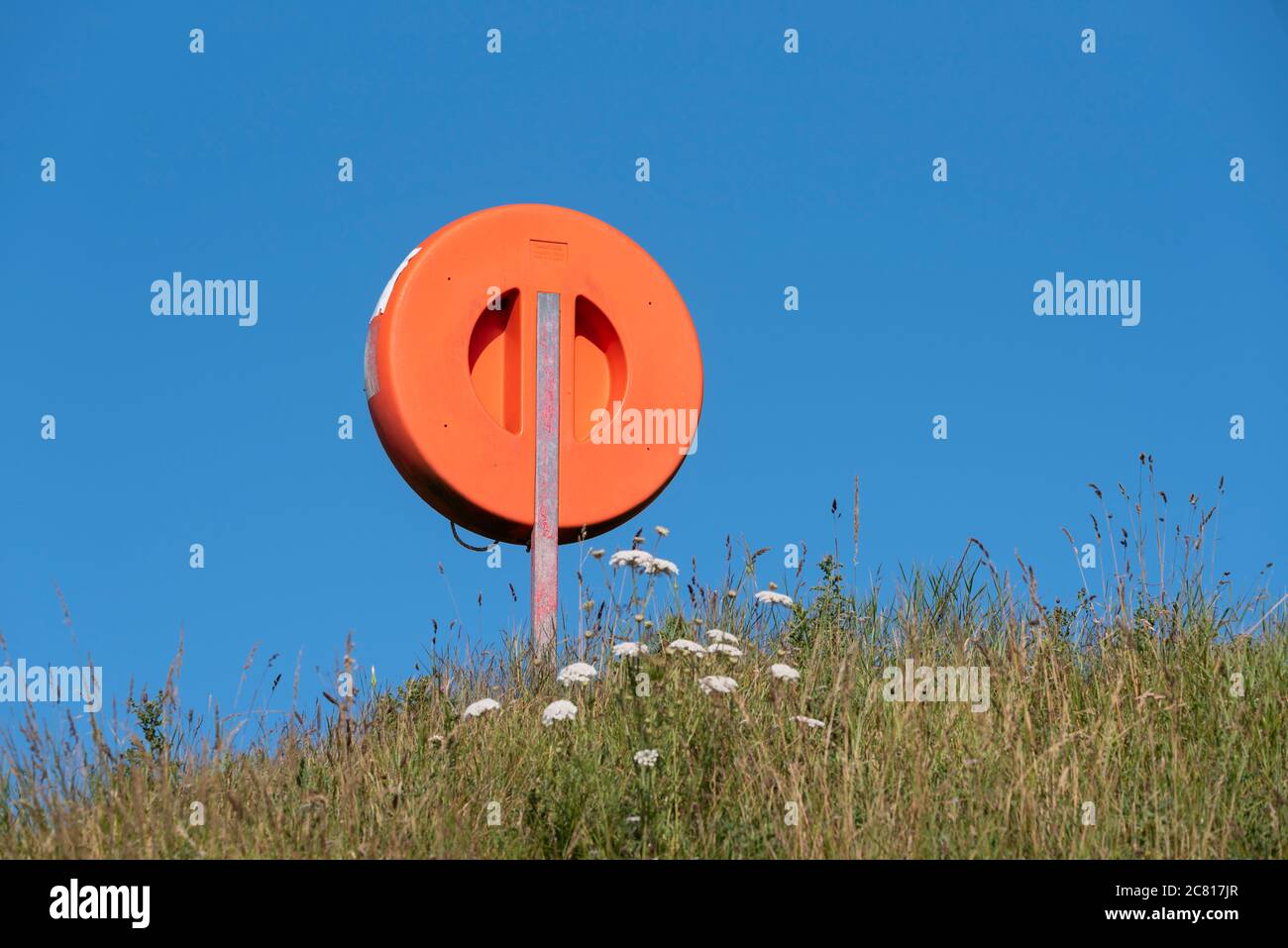 Lifebouy at seaside Stock Photo