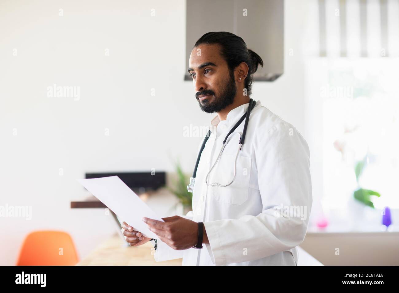 Indian male doctor in white hi-res stock photography and images - Alamy