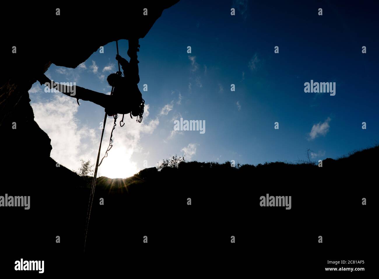 Woman rappelling from cliff in Swanage / UK Stock Photo - Alamy
