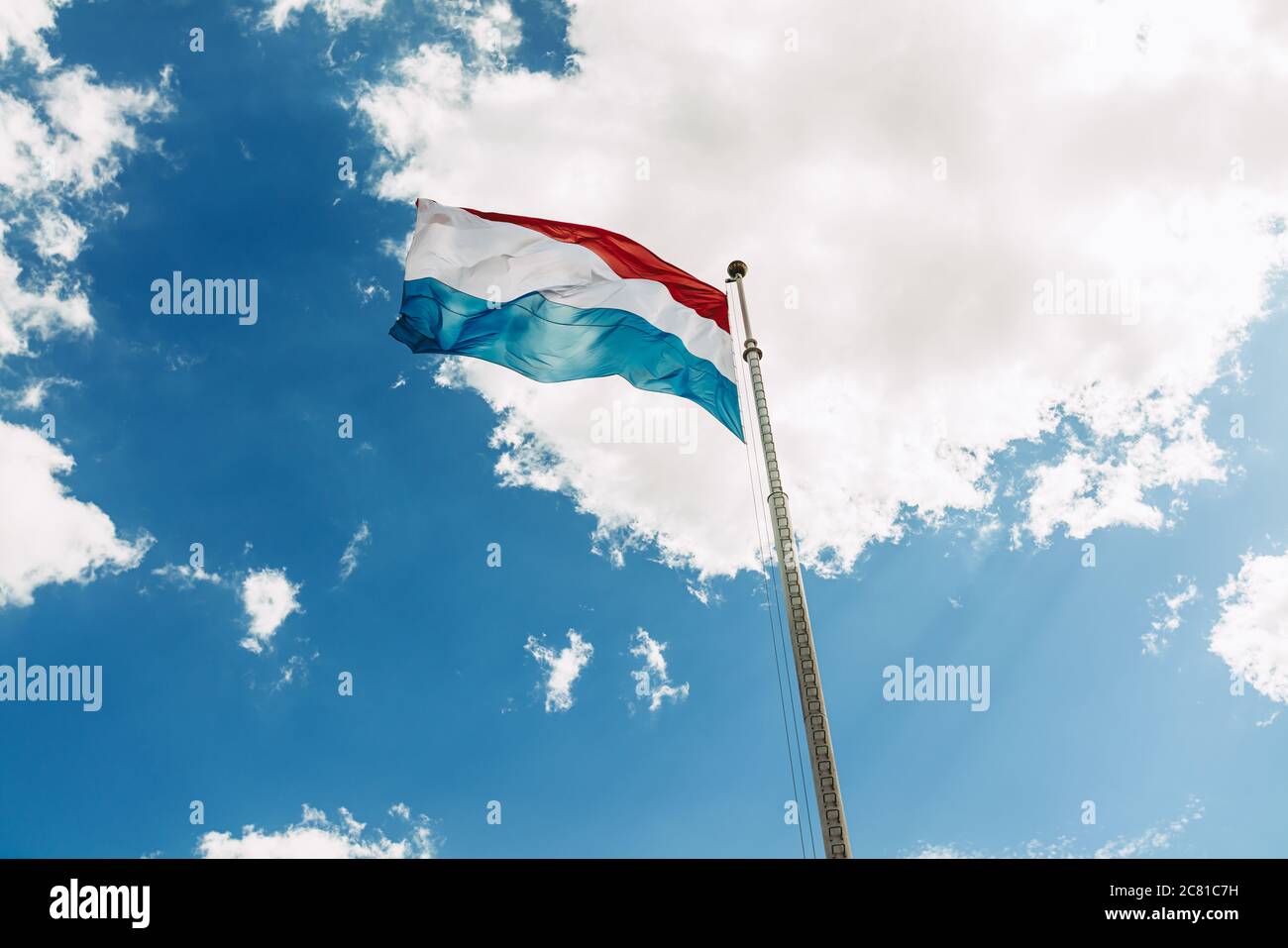 The luxembourg national flag waving over the Petrusse valley Stock Photo