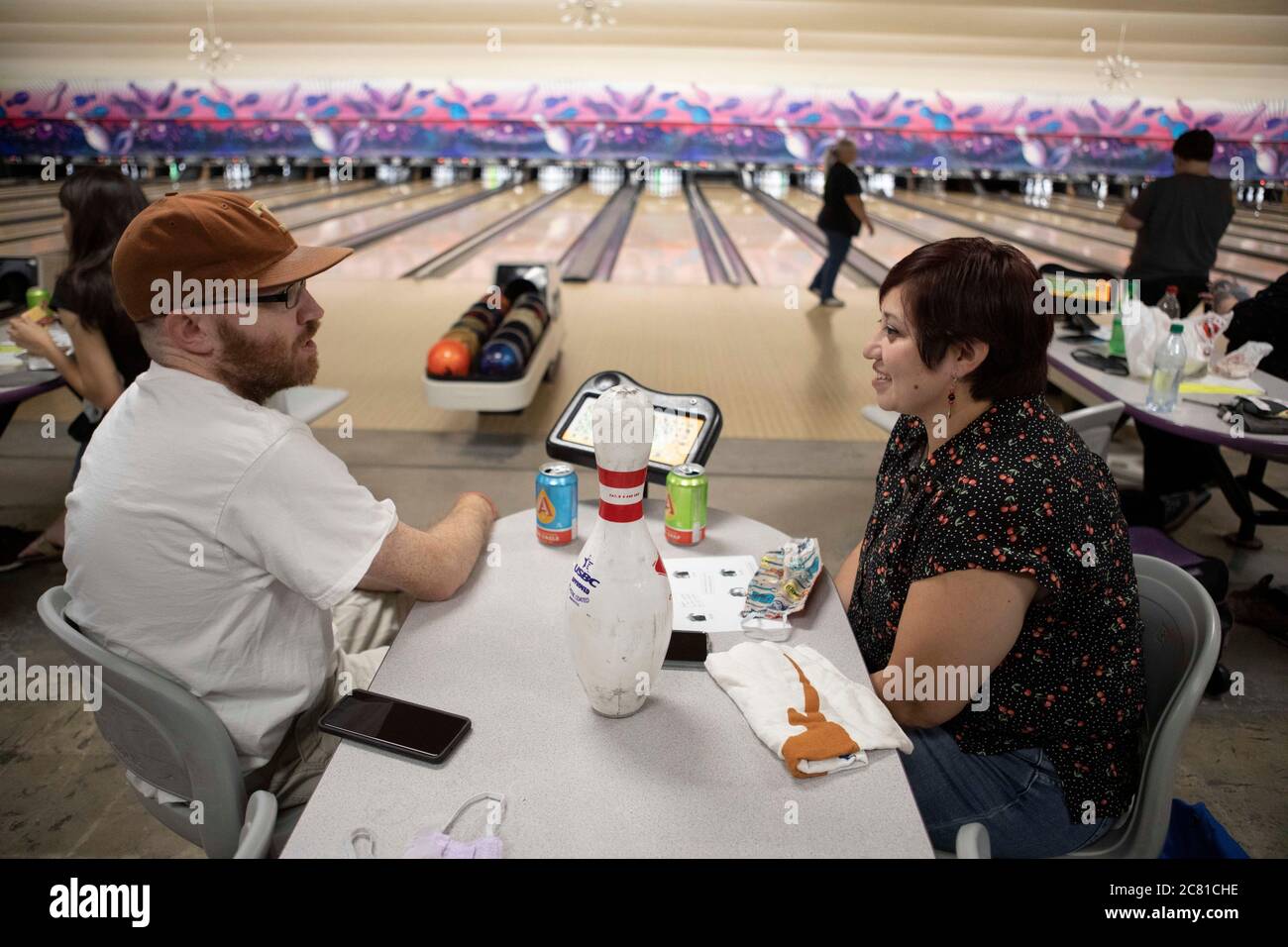 Austin, TX USA July 17, 2020: Patron s MICHELLE and CHARLES WARNER enjoy the last bowling night at Dart Bowl as the lanes, open for 64 years, close due to economic struggles and the COVID-19 pandemic. Dart Bowl's legendary cafe also served up its last plate of homemade enchiladas and cheap beer. Credit: Bob Daemmrich/Alamy Live News Stock Photo