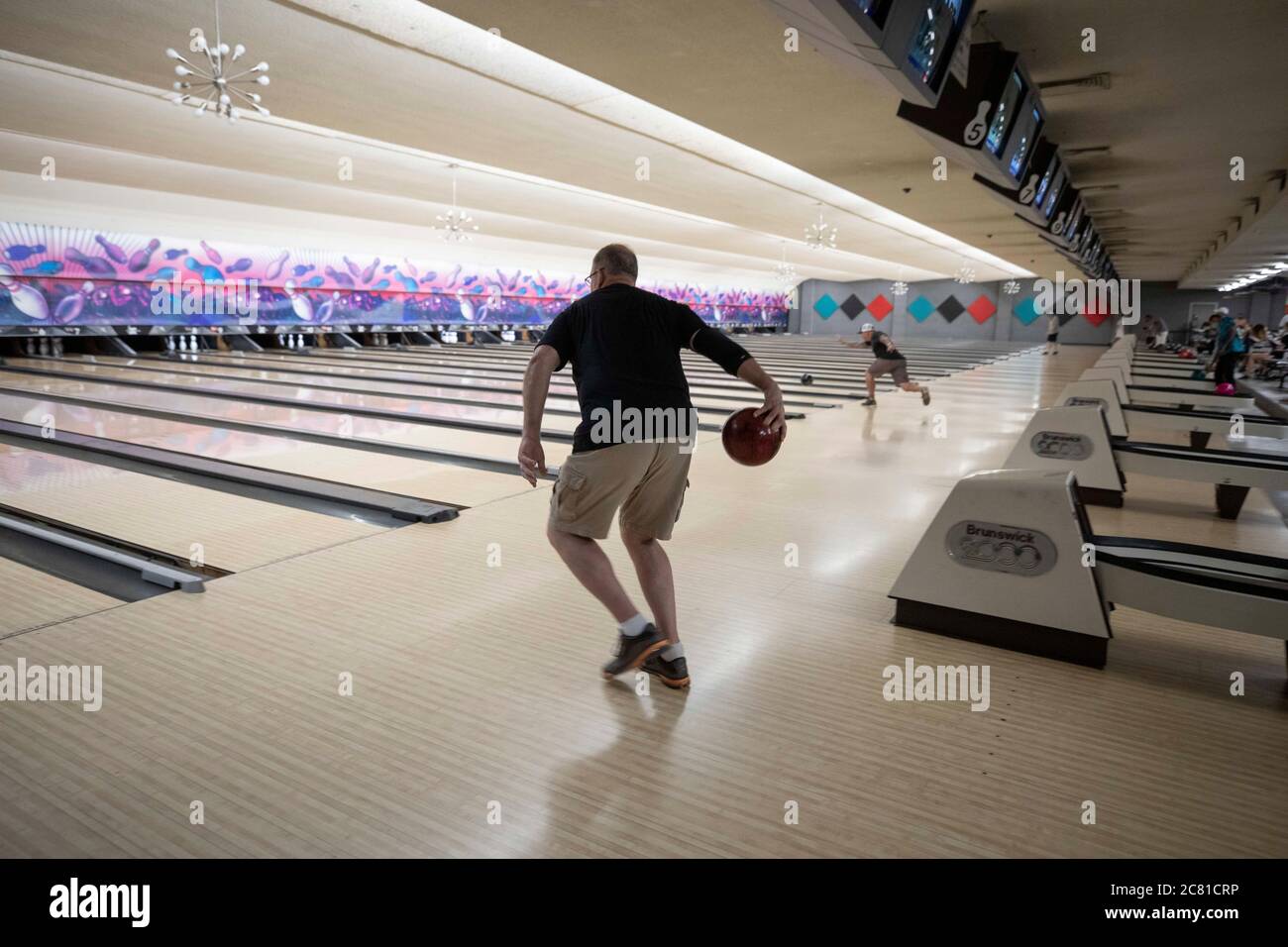 Austin, TX USA July 17, 2020: Patrons enjoy the last bowling night at Dart Bowl as the 64-year-old business in central Austin closes due to economic struggles and the COVID-19 pandemic. Credit: Bob Daemmrich/Alamy Live News Stock Photo
