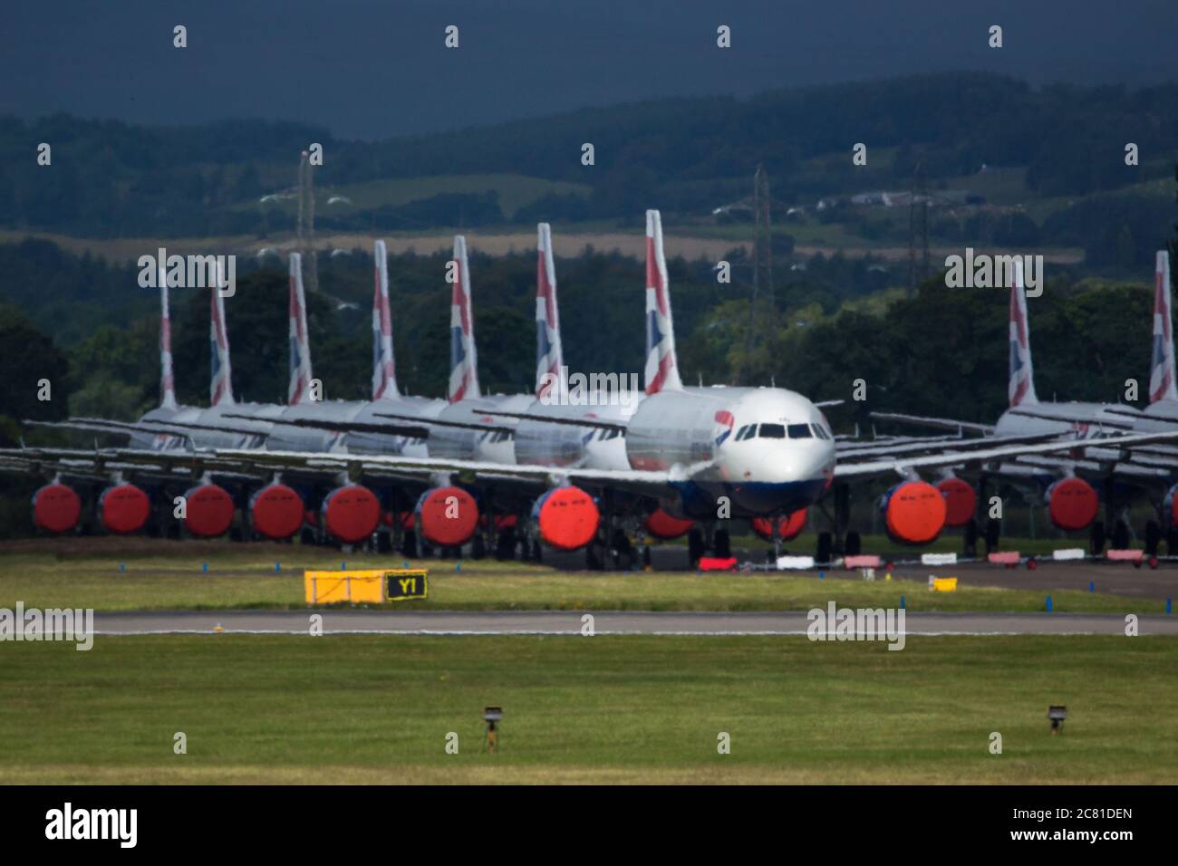 Glasgow, Scotland, UK. 20 July 2020 Pictured: Grounded BA jets at Glasgow Airport. Since March, all flights in and out of the UK were grounded the UK went into lockdown following a sharp rise in coronavirus cases in Europe. On July 6, many flights resumed, although the Foreign Commonwealth Office advised travel only where absolutely necessary. According to new terms currently being drafted between the British Airline Pilots' Association (BALPA) and British Airways, captains and first officers placed in the pool will remain on half-pay until they are needed. Credit: Colin Fisher/Alamy Live News Stock Photo