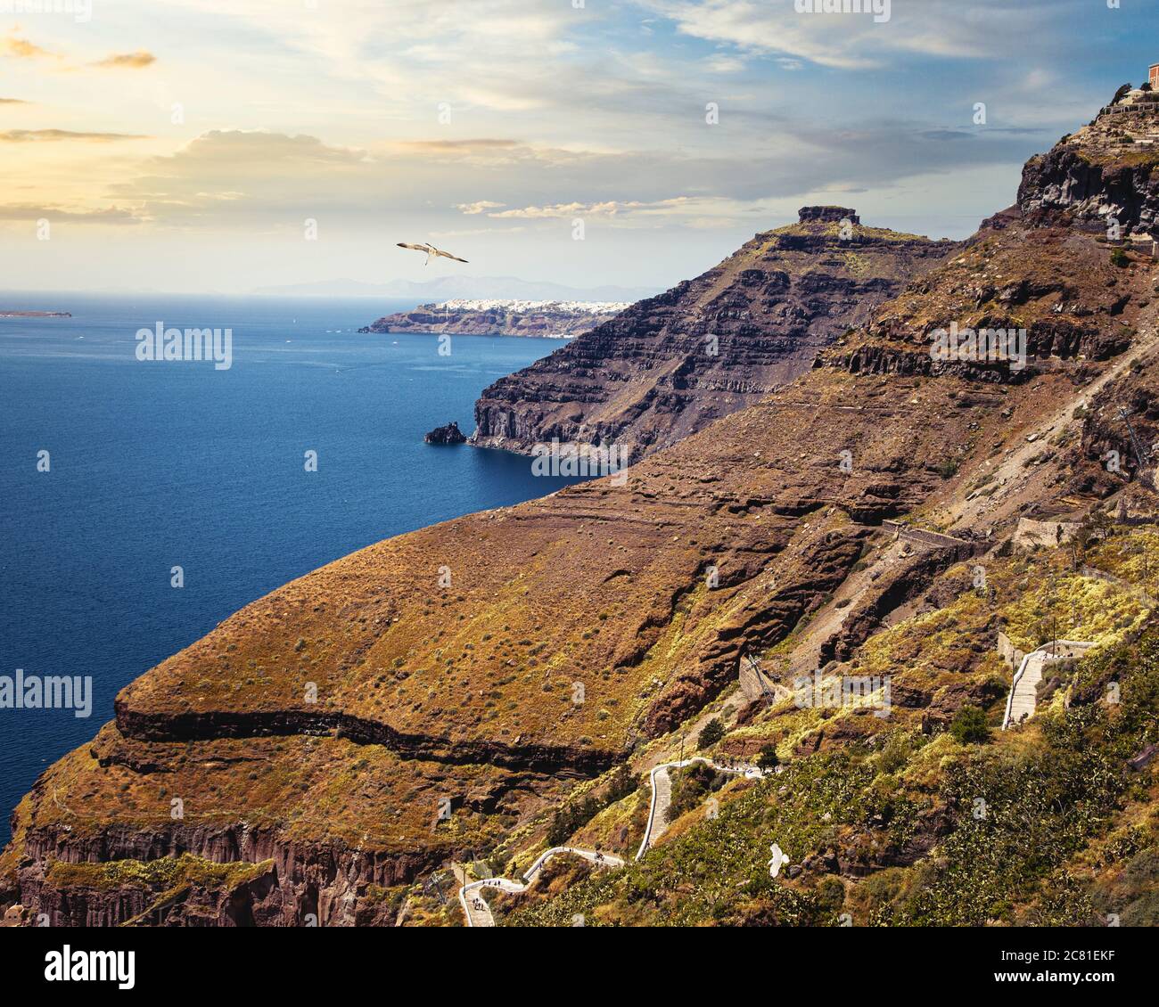 A distant view of Oia along the coast of Santorini from Fira, Greece. Stock Photo