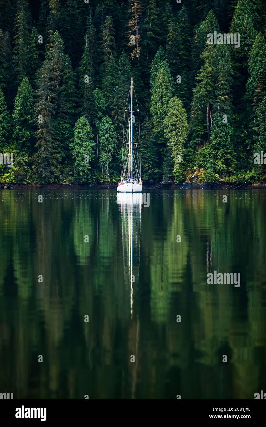 Sailboat in an estuary, Great Bear Rainforest; Hartley Bay, British Columbia, Canada Stock Photo