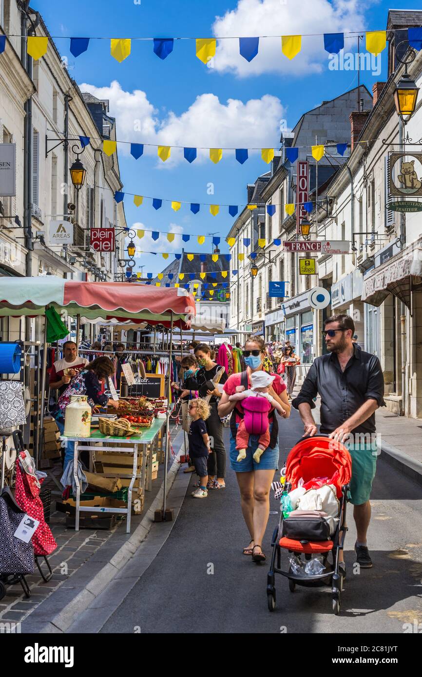 Crowded narrow town centre street on market day - Loches, Indre-et-Loire, France. Stock Photo