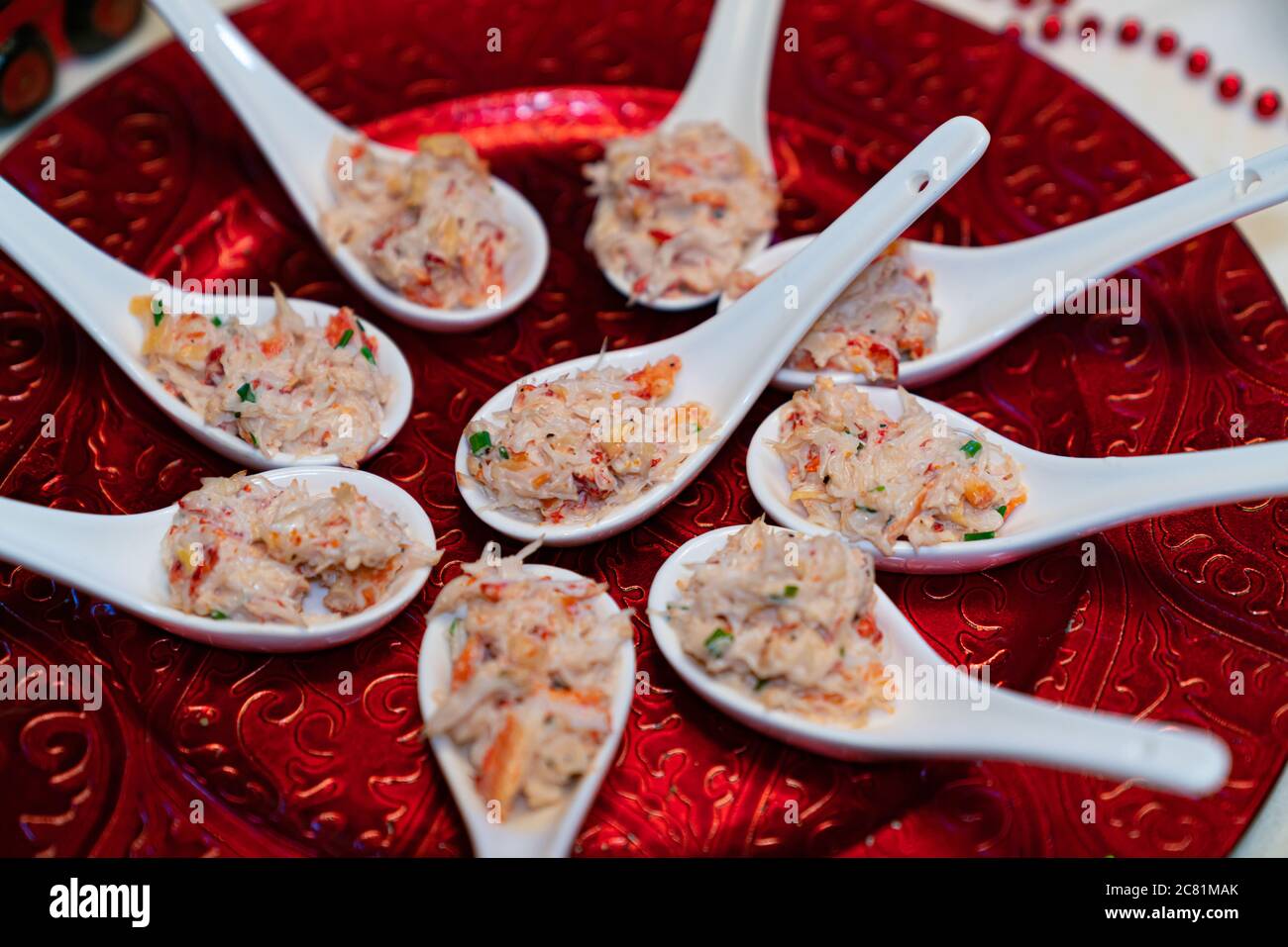 King crab appetizers served in slab spoons, at a celebration or dinner. Stock Photo
