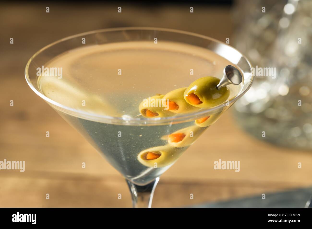 Boozy Traditional Dirty Martini with Olive Garnish Stock Photo