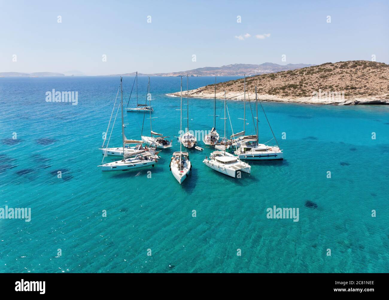 Polyaigos, Cyclades / Greece: 14 May 2018: Sailing boats in star formation. Polyaigos is the largest uninhabited island of the Aegean Sea and one of t Stock Photo