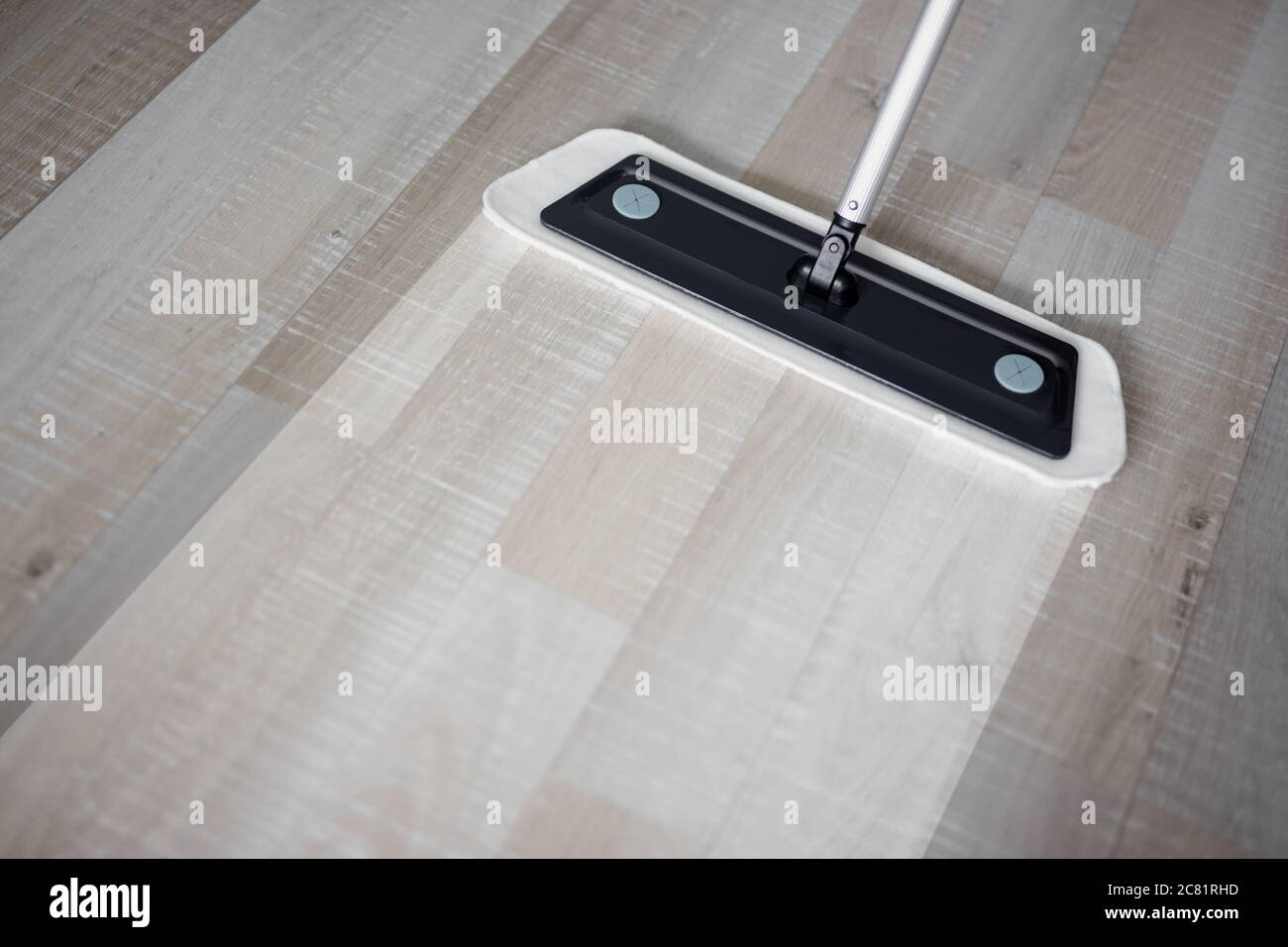 before and after cleaning concept - close up of microfiber floor mop on  wooden background with copy space Stock Photo - Alamy
