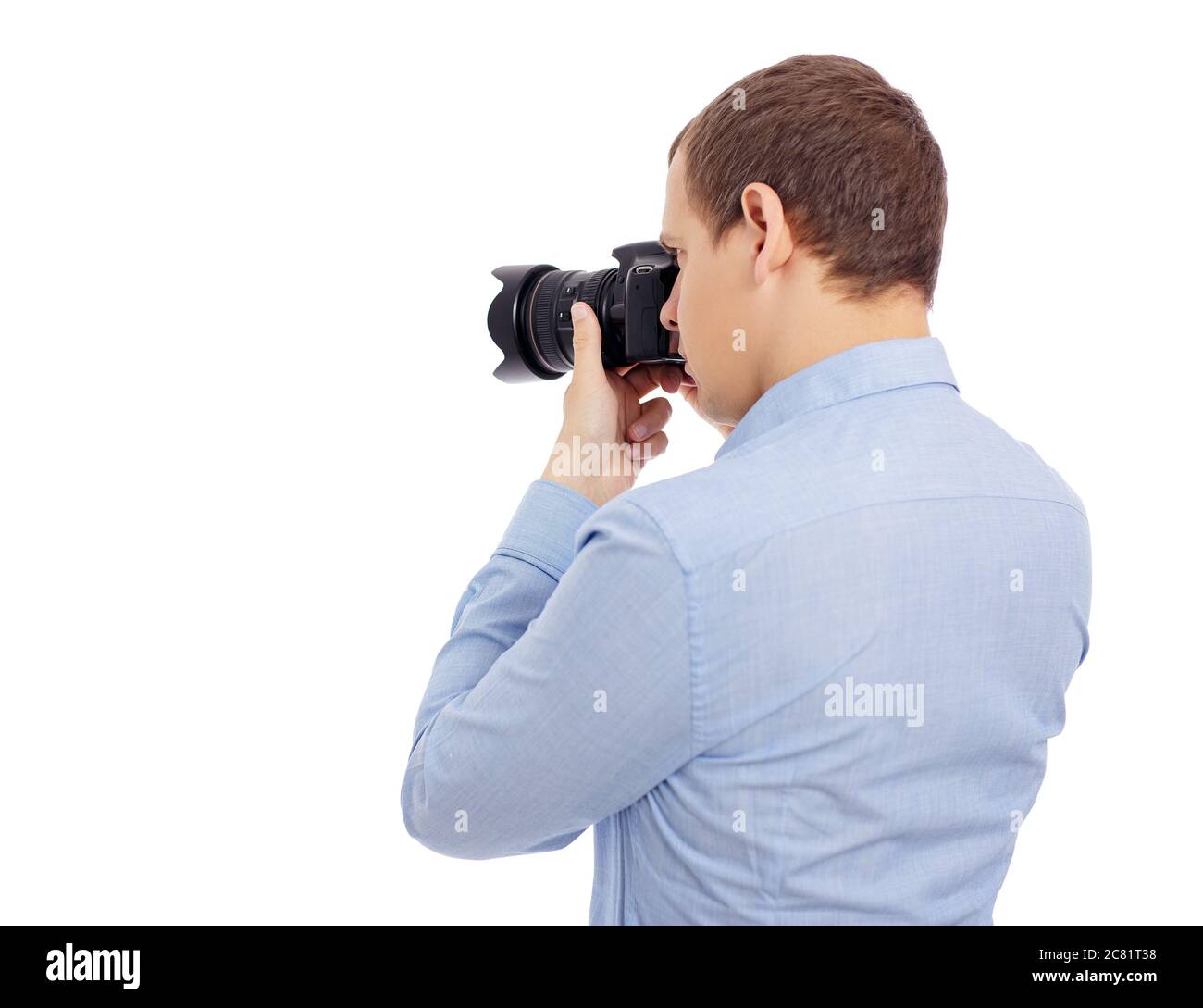 back view of male photographer taking photo with modern dslr camera