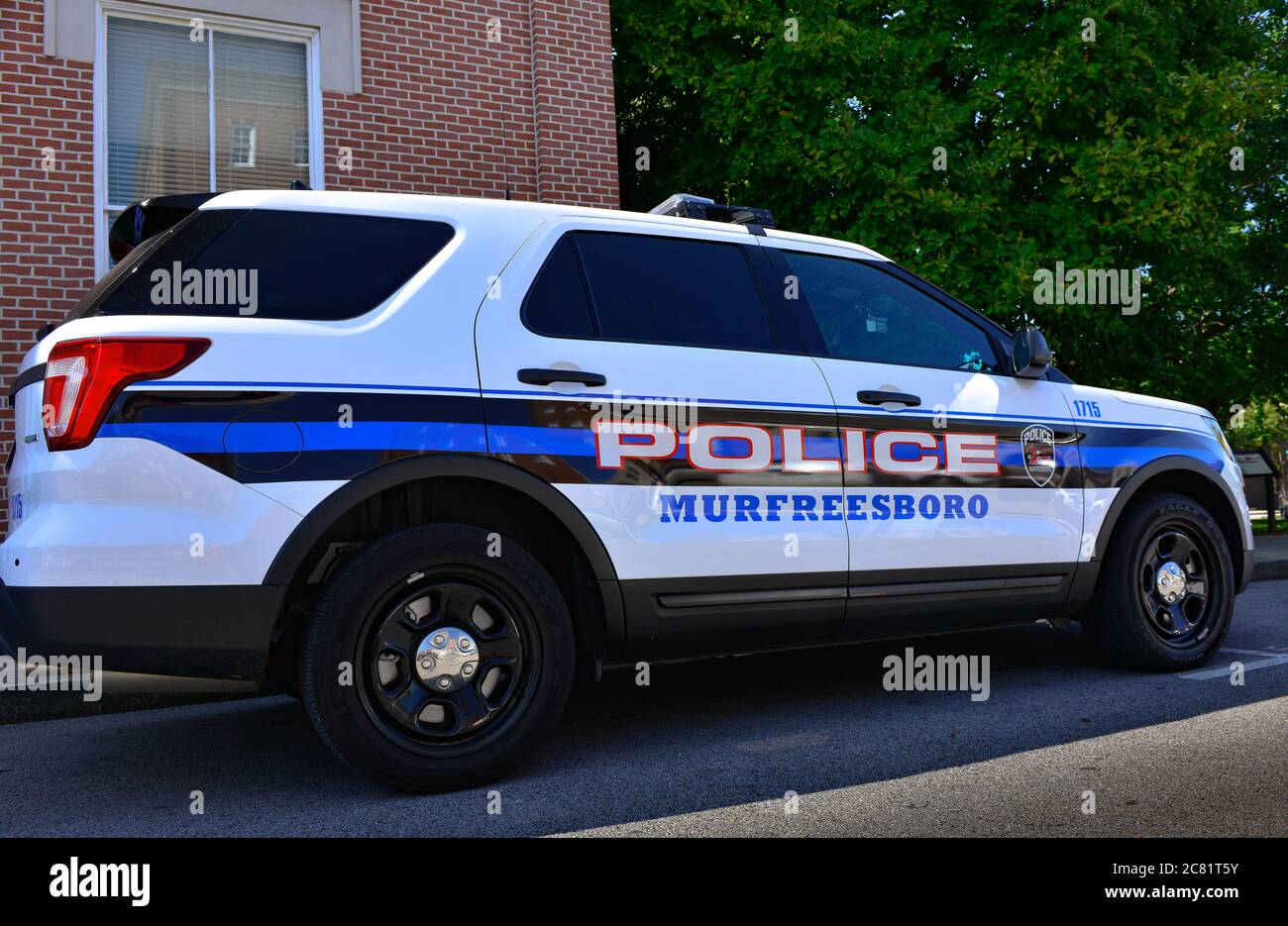 A parked Murfreesboro Tennessee Police SUV patrol car, with the graphic design signage on vehicle in blue, black and red in Murfreesboro, TN Stock Photo
