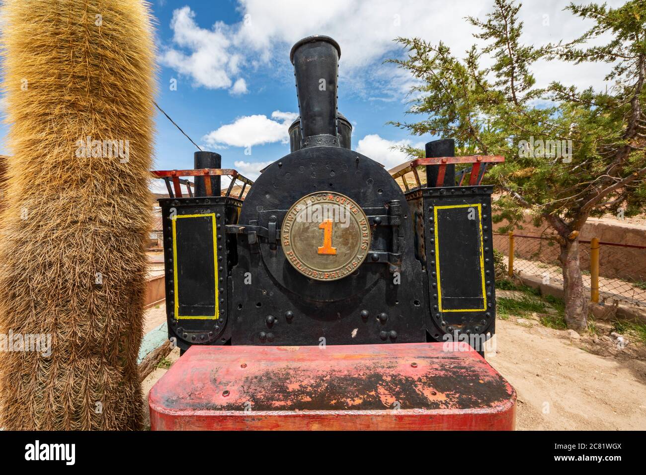 Baldwin locomotive 14301, built in 1895, partially restored and plinthed above mine entrance; Pulacayo, Potosi Department, Bolivia Stock Photo