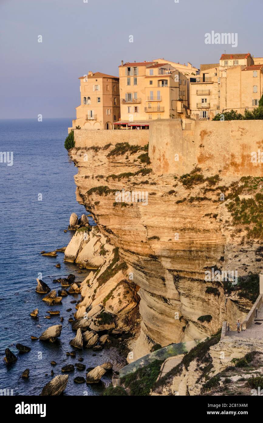The fortified old town of Bonifacio is perched on top of limestone cliffs eroded by the waves below to create the natural ledge high above the sea. Stock Photo