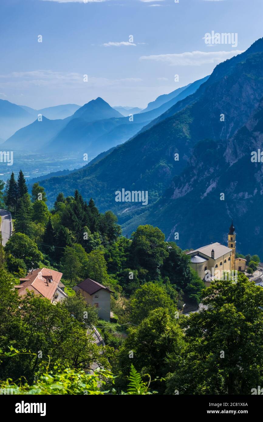 Pergine Valsugana, Italy - August 12, 2019: Village under mountain range and small town in valle of Italian Alps, Trentino Alto Adige, Trento Province Stock Photo