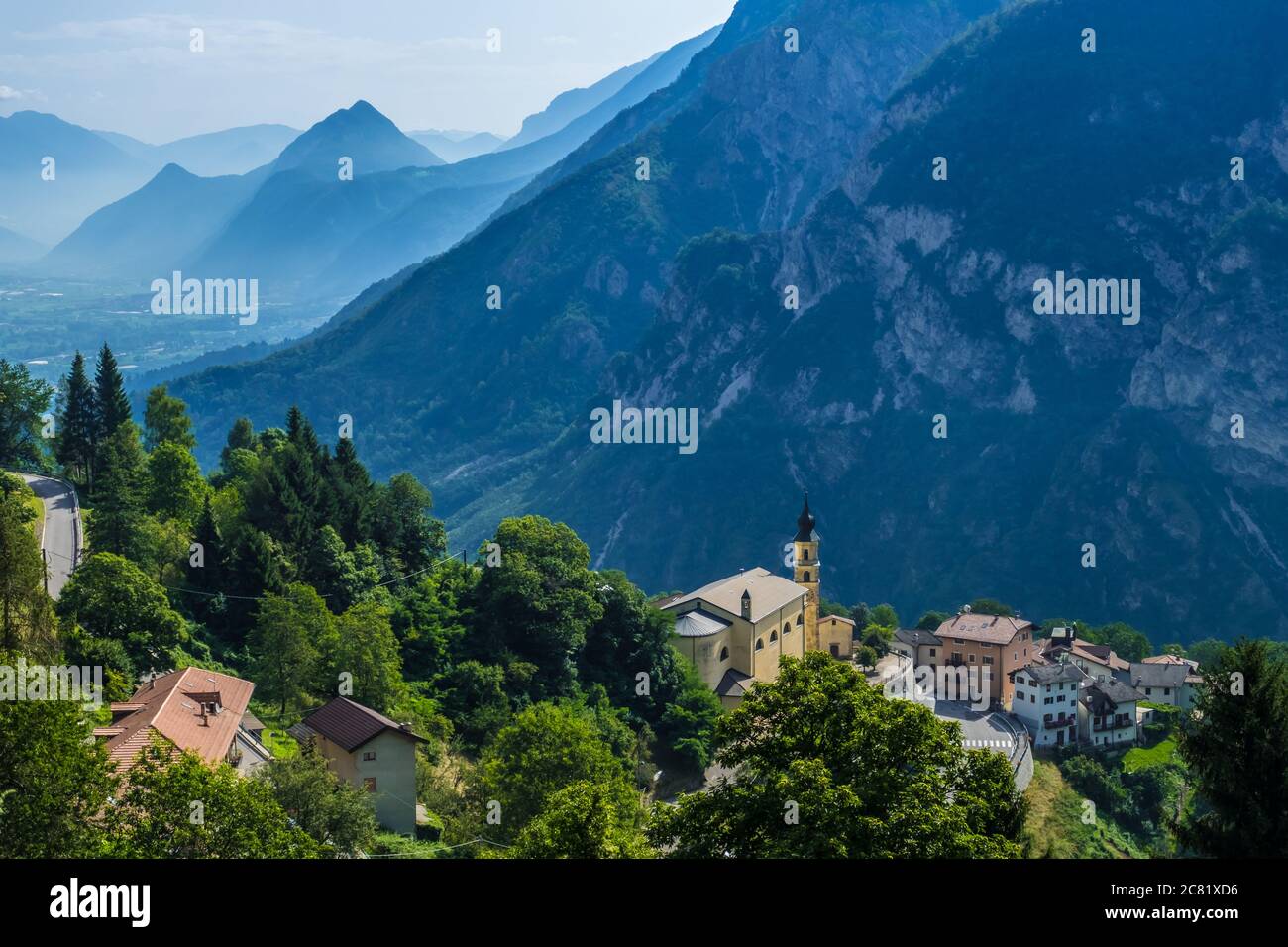 Pergine Valsugana, Italy - August 12, 2019: Village under mountain range and small town in valle of Italian Alps, Trentino Alto Adige, Trento Province Stock Photo