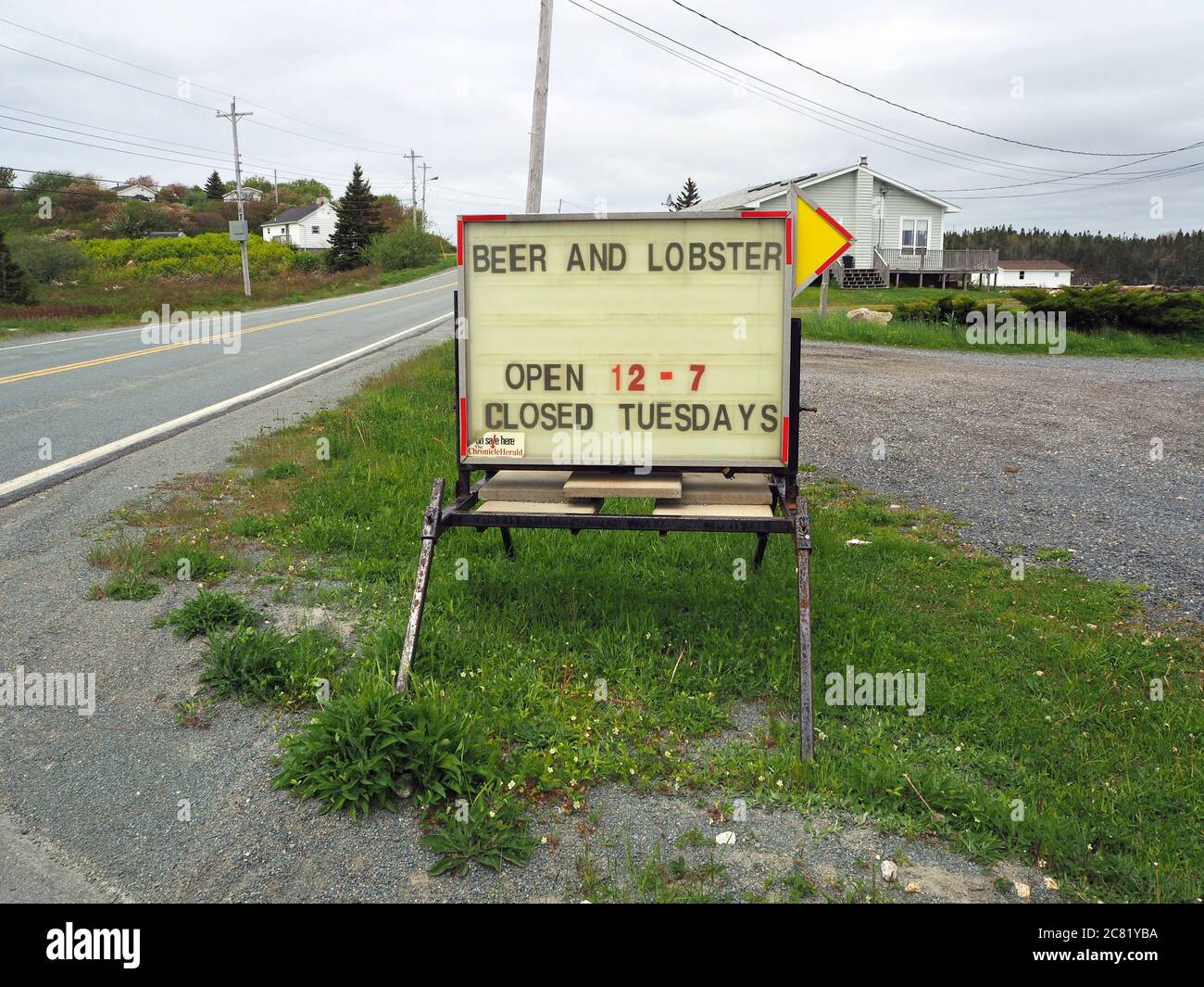 Beer and loster sign outside Shaw’s Landing restaurant, Peggys Cove Road, West Dover, Nova Scotia, Canada Stock Photo