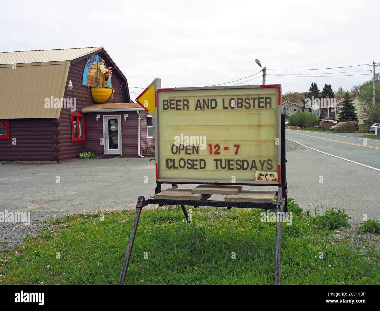Beer and loster sign outside Shaw’s Landing restaurant, Peggys Cove Road, West Dover, Nova Scotia, Canada Stock Photo