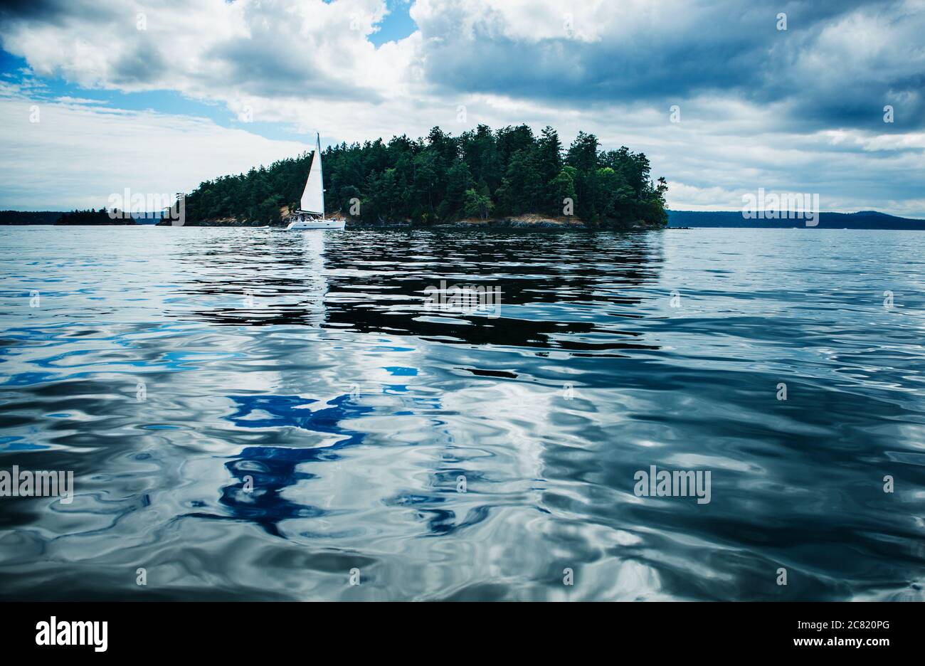 San Juan Islands with sail boat, Washington state, Pacific Northwest Stock Photo
