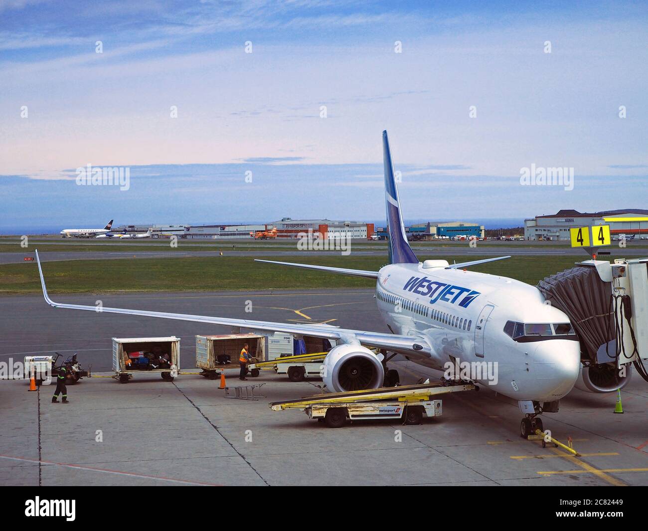 Westjet aircraft on stand at St John’s International Airport YYT, St John’s, Newfoundland, Newfoundland and Labrador, Canada Stock Photo