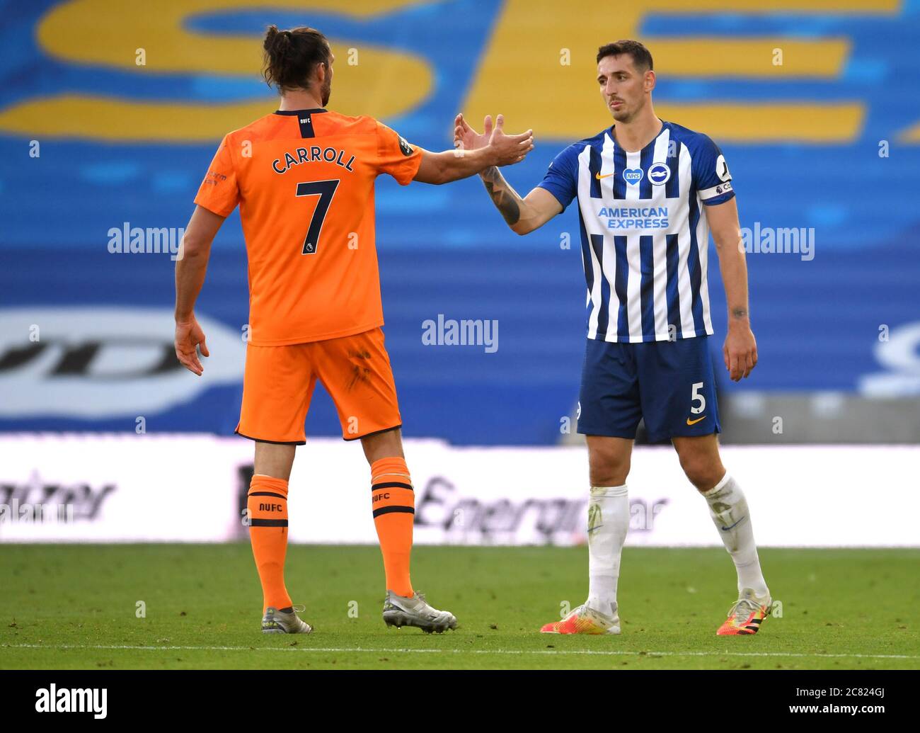 Newcastle United's Andy Carroll (left) and Brighton and Hove Albion's Lewis Dunk shake hands after the final whistle during the Premier League match at the Amex Stadium, Brighton. Stock Photo
