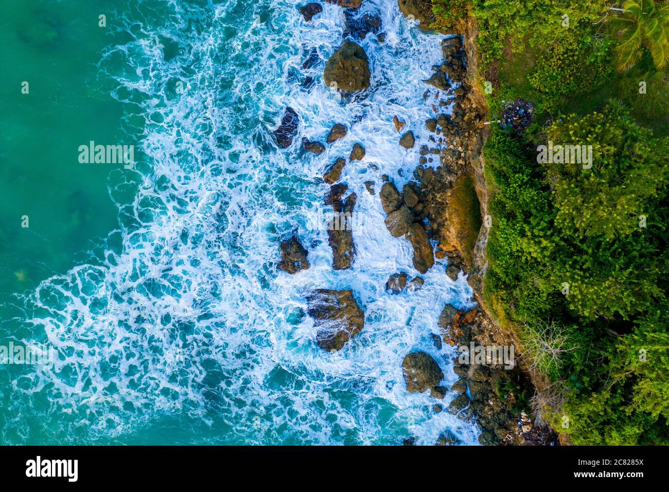 Aerial beautiful shot of an island seashore with a sea on the side ...