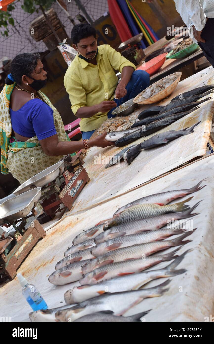 Hyderabad, Telangana, India. july202020 peoples wearing at fish market, customer buying fish