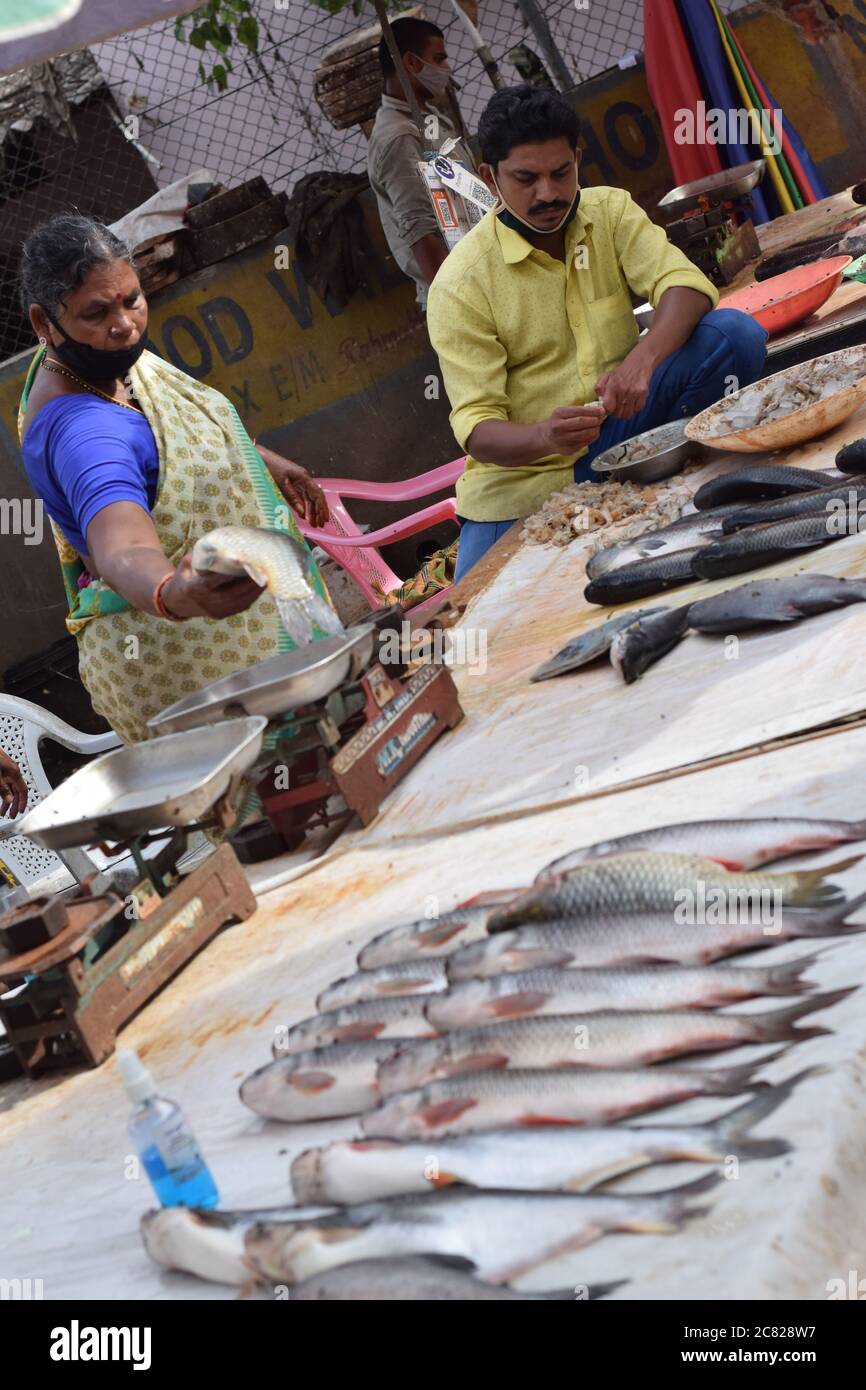 Hyderabad, Telangana, India. july202020 peoples wearing at fish market, customer buying fish