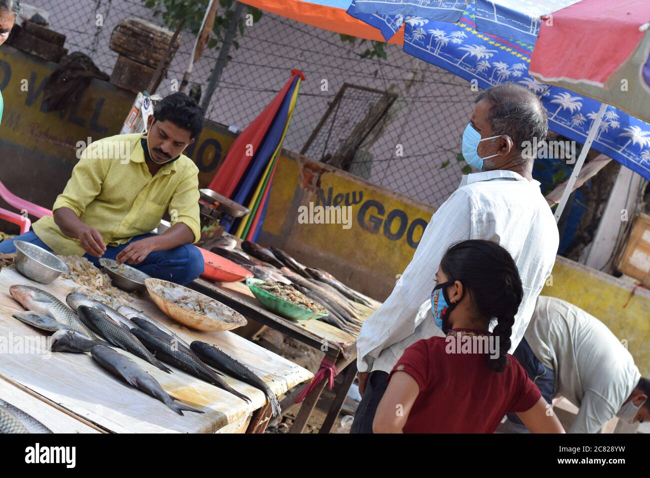 Hyderabad, Telangana, India. july202020 peoples wearing at fish market, customer buying fish