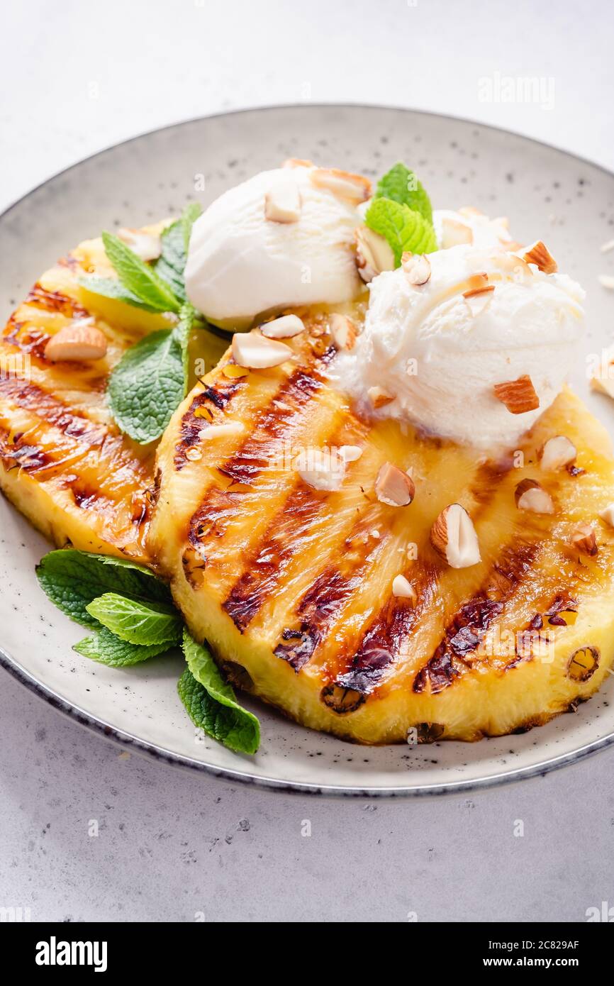 Grilled pineapple with ice cream Stock Photo Alamy