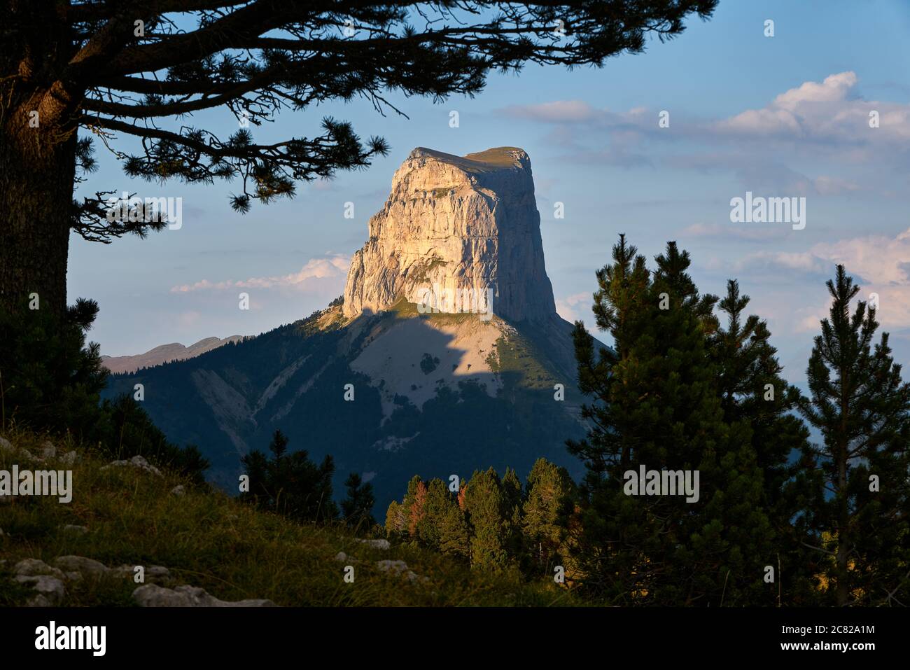 Mont Aiguille and the Vercors High Plateaus in summer at sunset. Vercors Regional Natural Park, Isere, Rhone-Alpes, Alps, France Stock Photo