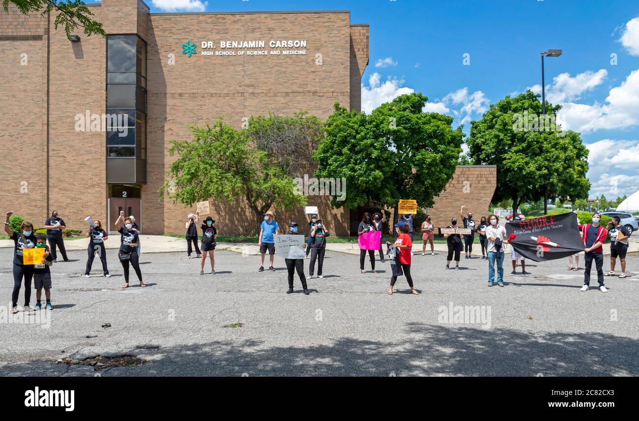 Detroit, Michigan, USA. 20th July, 2020. Concerned about reopening schools during the coronavirus pandemic, teachers held a car caravan and then a rally outside Benjamin Carson High School to demand 'safe school or no school.' Credit: Jim West/Alamy Live News Stock Photo