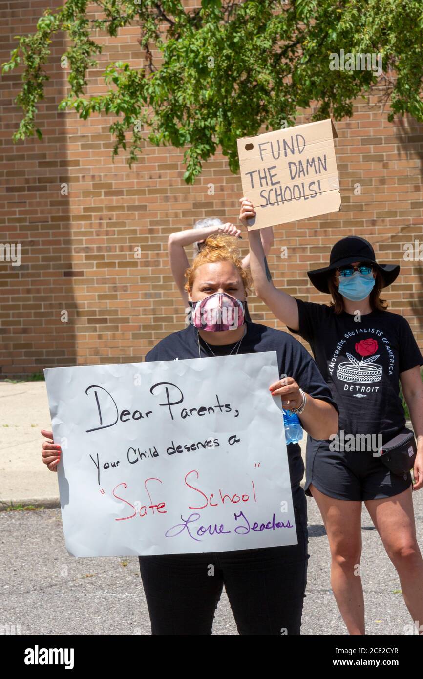 Detroit, Michigan, USA. 20th July, 2020. Concerned about reopening schools during the coronavirus pandemic, teachers held a car caravan and then a rally outside Benjamin Carson High School to demand 'safe school or no school.' Credit: Jim West/Alamy Live News Stock Photo