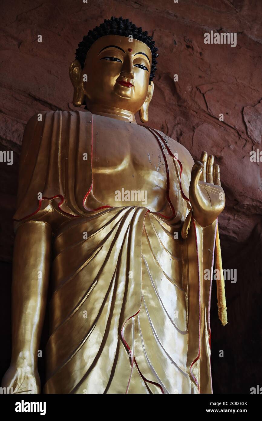 Big gilded statue-Standing Buddha-Tibetan Buddhist Hall-Thirtythree Heaven Grottoes-MatiSi. Sunan County-Zhangye-Gansu-China-0978 Stock Photo