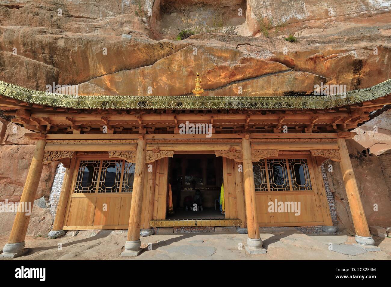 Wooden porch-small cave temple. Thirtythree Heaven Grottoes area-Horse Hoof temple-Zhangye-Gansu-China-0980 Stock Photo