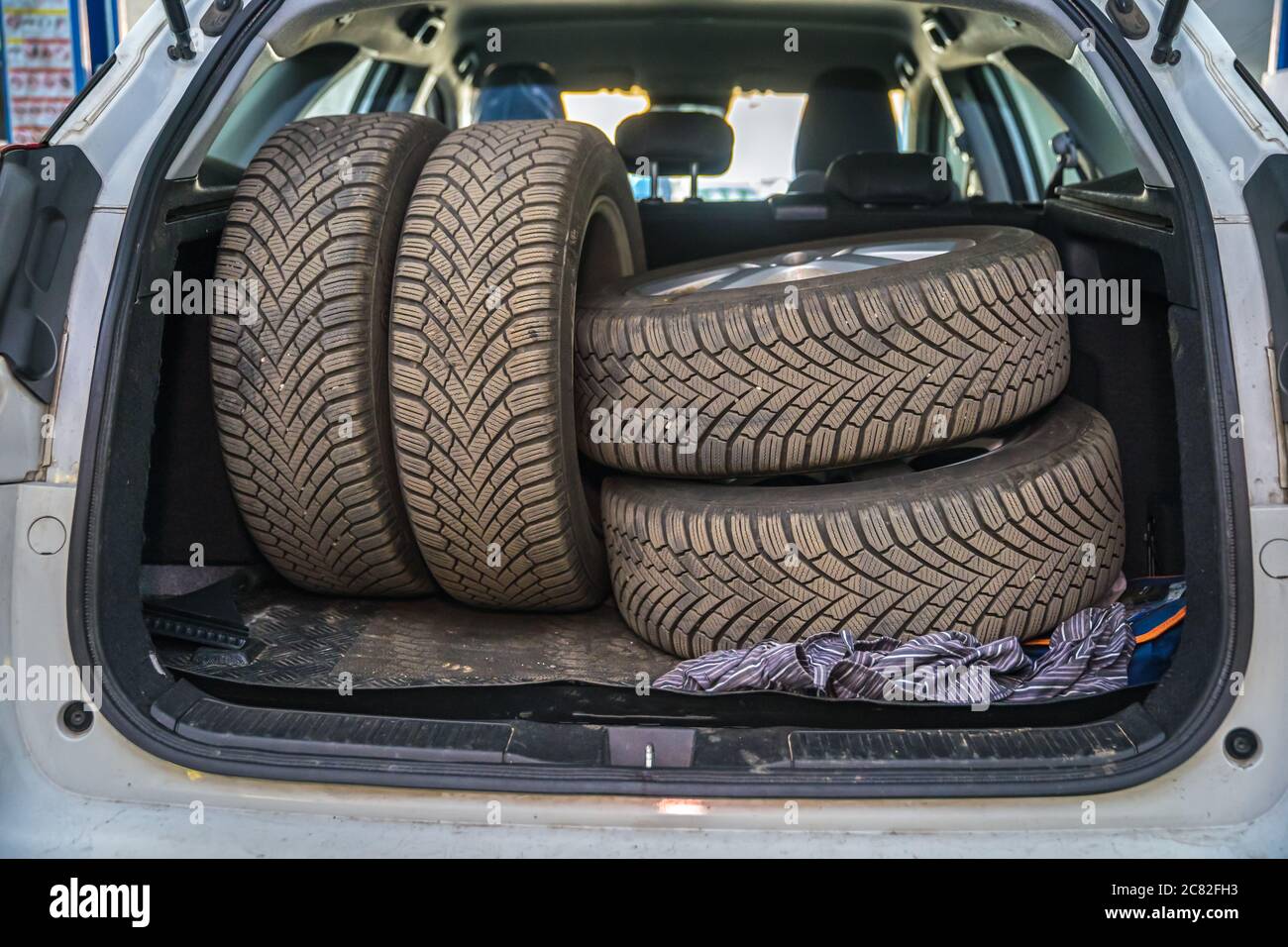 seasonal wheel change, spare tires in the trunk of a car Stock Photo