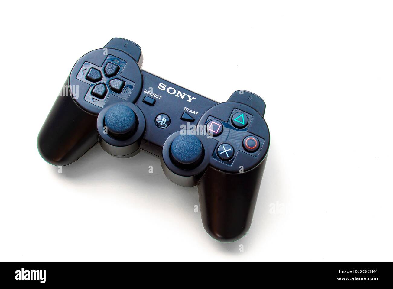 Calgary, Alberta, Canada. July 20, 2020. Black Sony Play Station control remote on a white background Stock Photo