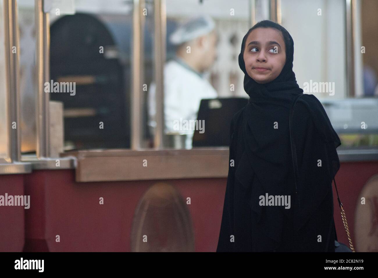 Muslim young girl wearing hijab. Souq Waqif, Doha, Qatar Stock Photo