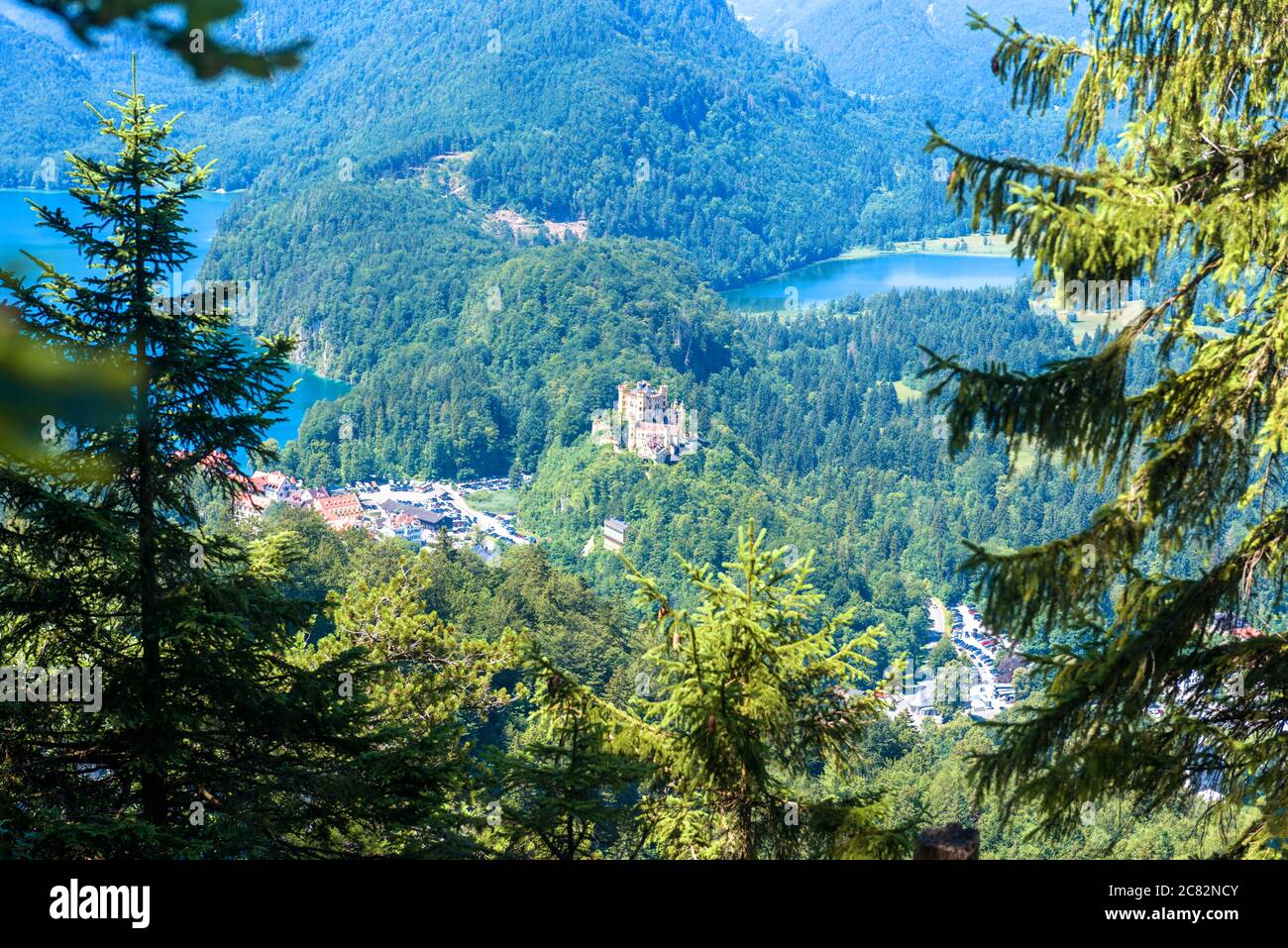 Landscape of Bavarian Alps with Hohenschwangau Castle, Germany. Scenic view of beautiful castle between lakes and Schwangau village, scenery of Alpine Stock Photo